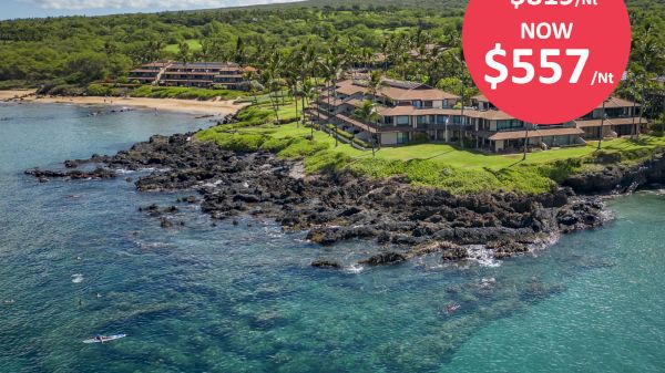 A coastal resort with lush greenery and rocky shoreline, advertising a discounted rate from $819/night to $557/night in a red circle.