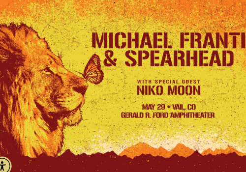 Poster for Michael Franti & Spearhead concert with Niko Moon, featuring a lion and butterfly, May 29, Vail, CO, Ford Amphitheater.